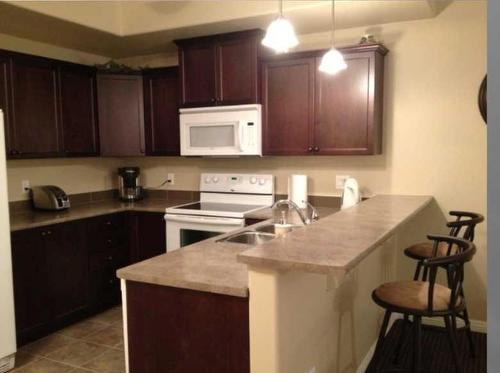 212-4102 69 Avenue, Lloydminster, AB - Indoor Photo Showing Kitchen With Double Sink