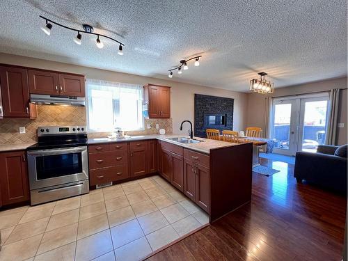 910 29 Street, Wainwright, AB - Indoor Photo Showing Kitchen With Double Sink