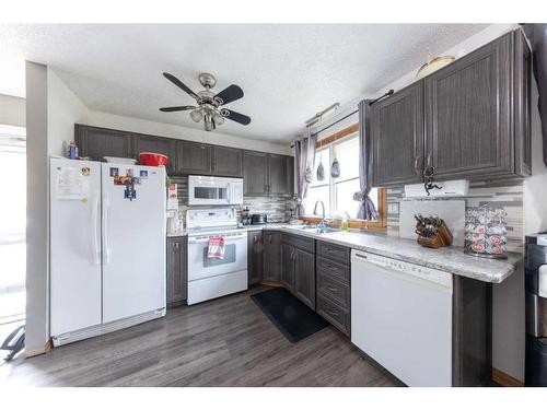 206 3 Avenue North, Marwayne, AB - Indoor Photo Showing Kitchen With Double Sink