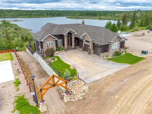820 Spruce Street, Lac Des Iles, SK - Outdoor With Body Of Water With Facade