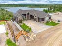 820 Spruce Street, Lac Des Iles, SK  - Outdoor With Body Of Water With Facade 
