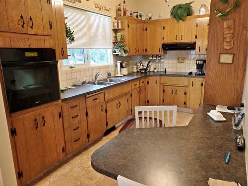 4809 Riverside Drive, Vermilion, AB - Indoor Photo Showing Kitchen With Double Sink