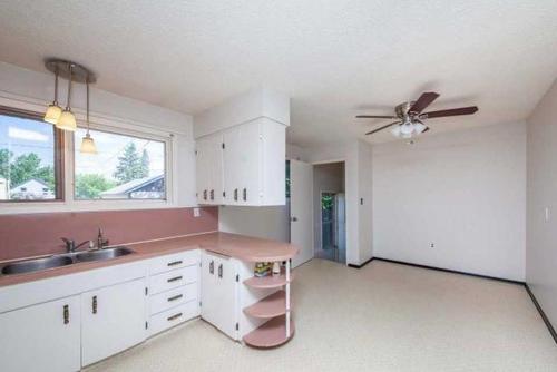 107 2Nd Street, Lashburn, SK - Indoor Photo Showing Kitchen With Double Sink