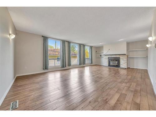 5516 47 Street, Lloydminster, AB - Indoor Photo Showing Living Room With Fireplace