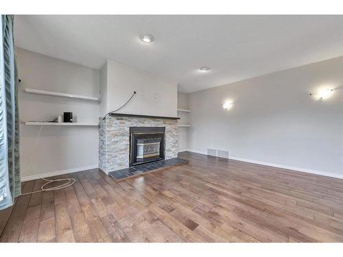 5516 47 Street, Lloydminster, AB - Indoor Photo Showing Living Room With Fireplace