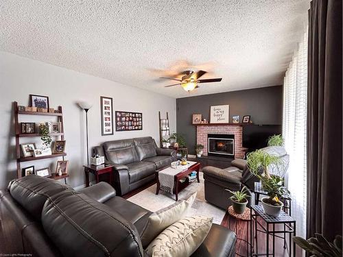5408 31 Street, Lloydminster, AB - Indoor Photo Showing Living Room With Fireplace