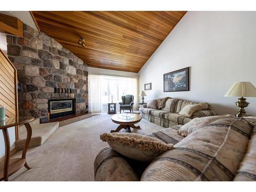 5213 47 Street, Lloydminster, AB - Indoor Photo Showing Living Room With Fireplace