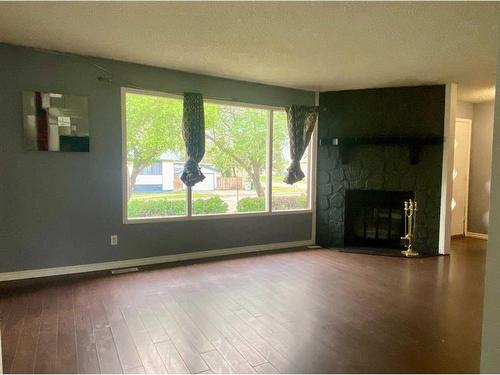 5339 52 Street, Provost, AB - Indoor Photo Showing Living Room With Fireplace