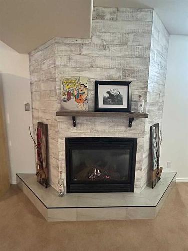 5203 64 Street, Vermilion, AB - Indoor Photo Showing Living Room With Fireplace