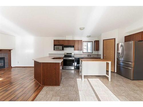 208 4 Avenue West, Maidstone, SK - Indoor Photo Showing Kitchen With Fireplace