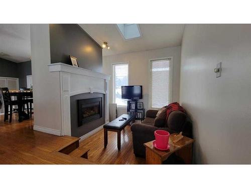 412 1 Street, Paradise Hill, SK - Indoor Photo Showing Living Room With Fireplace