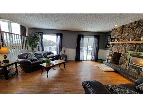 412 1 Street, Paradise Hill, SK - Indoor Photo Showing Living Room With Fireplace