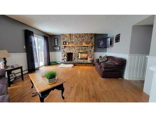 412 1 Street, Paradise Hill, SK - Indoor Photo Showing Living Room With Fireplace