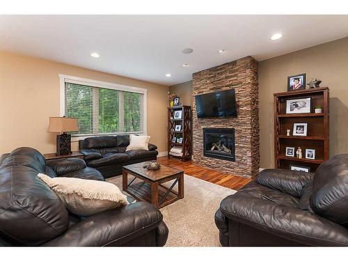 1605 53A Avenue Close, Lloydminster, AB - Indoor Photo Showing Living Room With Fireplace