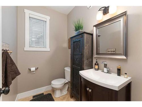 1605 53A Avenue Close, Lloydminster, AB - Indoor Photo Showing Living Room With Fireplace