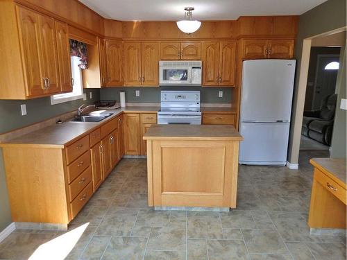 5115 51 Street, Mannville, AB - Indoor Photo Showing Kitchen With Double Sink