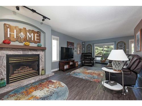 2606 51 Avenue, Lloydminster, AB - Indoor Photo Showing Living Room With Fireplace