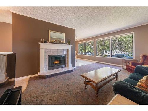 4906 58 Avenue, Lloydminster, AB - Indoor Photo Showing Living Room With Fireplace