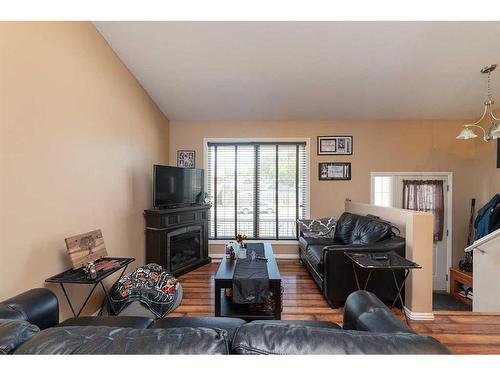 5302 50 Street, Kitscoty, AB - Indoor Photo Showing Living Room With Fireplace