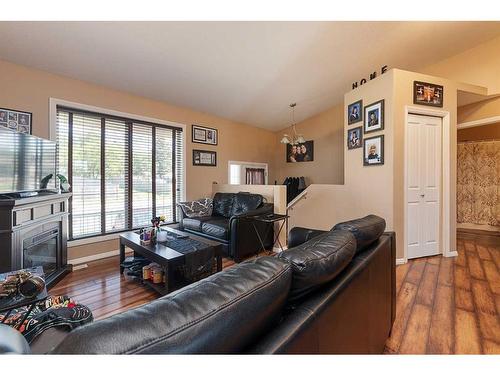 5302 50 Street, Kitscoty, AB - Indoor Photo Showing Living Room With Fireplace