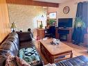 4739 53 Street, Innisfree, AB  - Indoor Photo Showing Living Room With Fireplace 