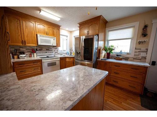 5011 49 Street, Consort, AB - Indoor Photo Showing Kitchen With Double Sink