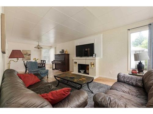 5414 48 Street, Lloydminster, AB - Indoor Photo Showing Living Room With Fireplace