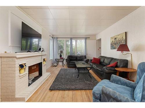 5414 48 Street, Lloydminster, AB - Indoor Photo Showing Living Room With Fireplace