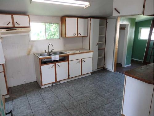 5012 51 Street, Mannville, AB - Indoor Photo Showing Kitchen With Double Sink