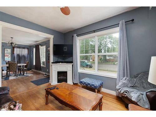 5619 50 Street, Lloydminster, AB - Indoor Photo Showing Living Room With Fireplace