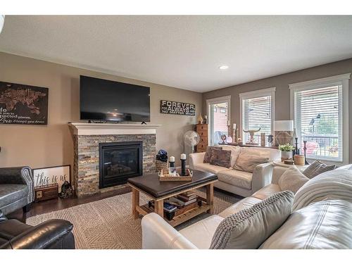 25-2715 73 Avenue, Lloydminster, AB - Indoor Photo Showing Living Room With Fireplace