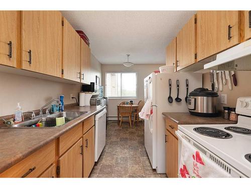 302-5607 31 Street, Lloydminster, AB - Indoor Photo Showing Kitchen With Double Sink