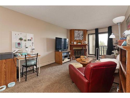 302-5607 31 Street, Lloydminster, AB - Indoor Photo Showing Living Room With Fireplace