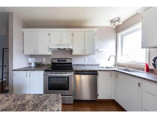 5205 50 Street, Kitscoty, AB - Indoor Photo Showing Kitchen With Stainless Steel Kitchen With Double Sink