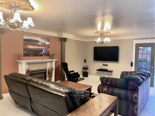 5132 48 Street, Mannville, AB - Indoor Photo Showing Living Room With Fireplace