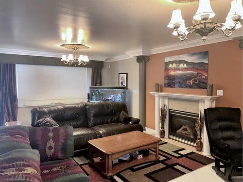 5132 48 Street, Mannville, AB - Indoor Photo Showing Living Room With Fireplace