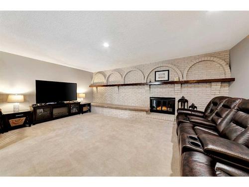 601 19 Street, Wainwright, AB - Indoor Photo Showing Other Room With Fireplace