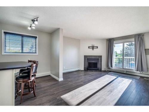 201A-3009 57A Avenue, Lloydminster, AB - Indoor Photo Showing Living Room With Fireplace