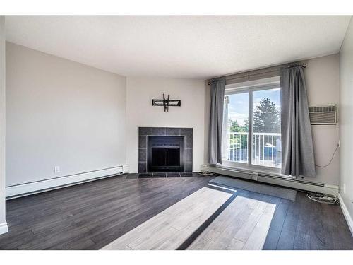 201A-3009 57A Avenue, Lloydminster, AB - Indoor Photo Showing Living Room With Fireplace