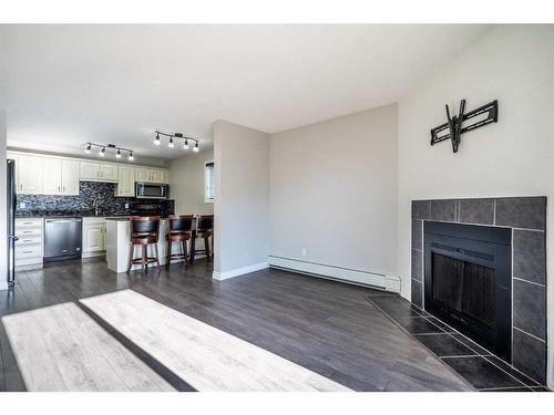 201A-3009 57A Avenue, Lloydminster, AB - Indoor Photo Showing Living Room With Fireplace