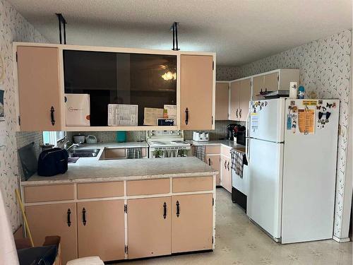 5741 45 Street, Lloydminster, AB - Indoor Photo Showing Kitchen With Double Sink