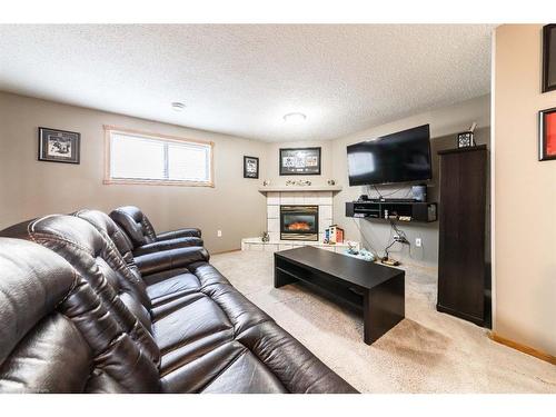 6609 34 Street, Lloydminster, AB - Indoor Photo Showing Living Room With Fireplace