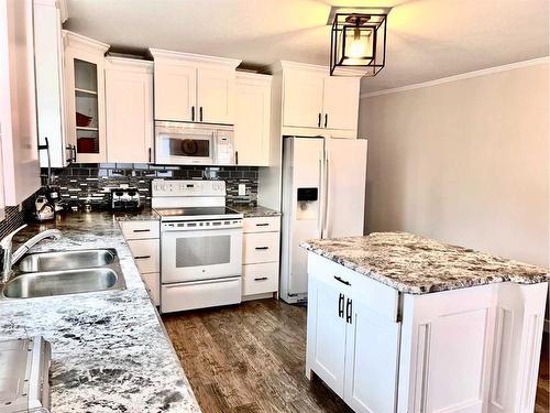 4708 51 Street, Mannville, AB - Indoor Photo Showing Kitchen With Double Sink