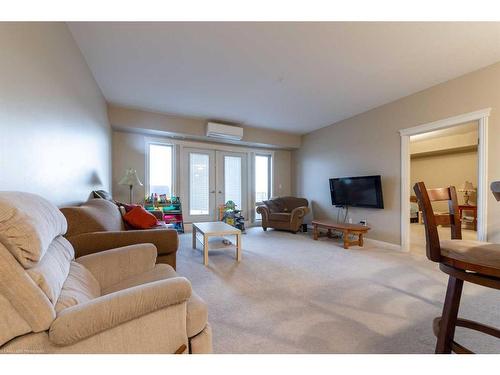 303-4102 69 Avenue, Lloydminster, AB - Indoor Photo Showing Living Room