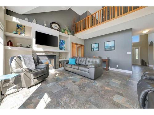 88 Whitetail Avenue, Rural Vermilion River, County Of, AB - Indoor Photo Showing Living Room With Fireplace