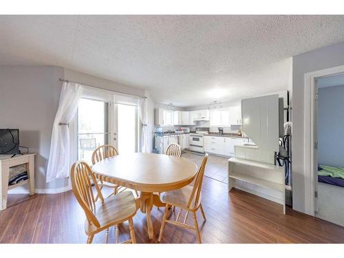 329 Birch Drive, Turtle Lake, SK - Indoor Photo Showing Dining Room With Fireplace