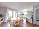 329 Birch Drive, Turtle Lake, SK  - Indoor Photo Showing Dining Room With Fireplace 