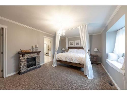 Ne-32-49-25-W3, Rural, SK - Indoor Photo Showing Bedroom With Fireplace