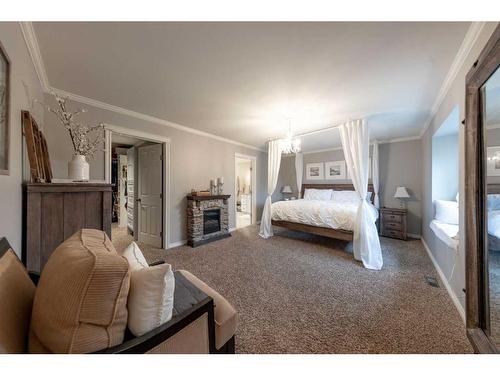 Ne-32-49-25-W3, Rural, SK - Indoor Photo Showing Bedroom With Fireplace