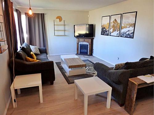 4702 52 Avenue, Vermilion, AB - Indoor Photo Showing Living Room With Fireplace